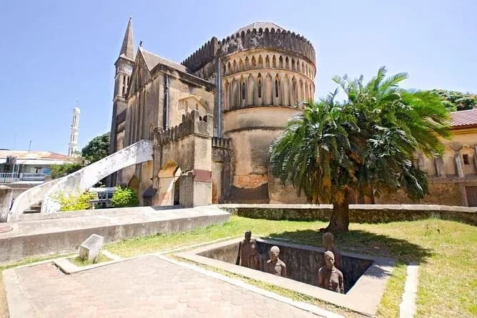 The slave-market memorial figures beside Christ Church cathedral in Stone Town.