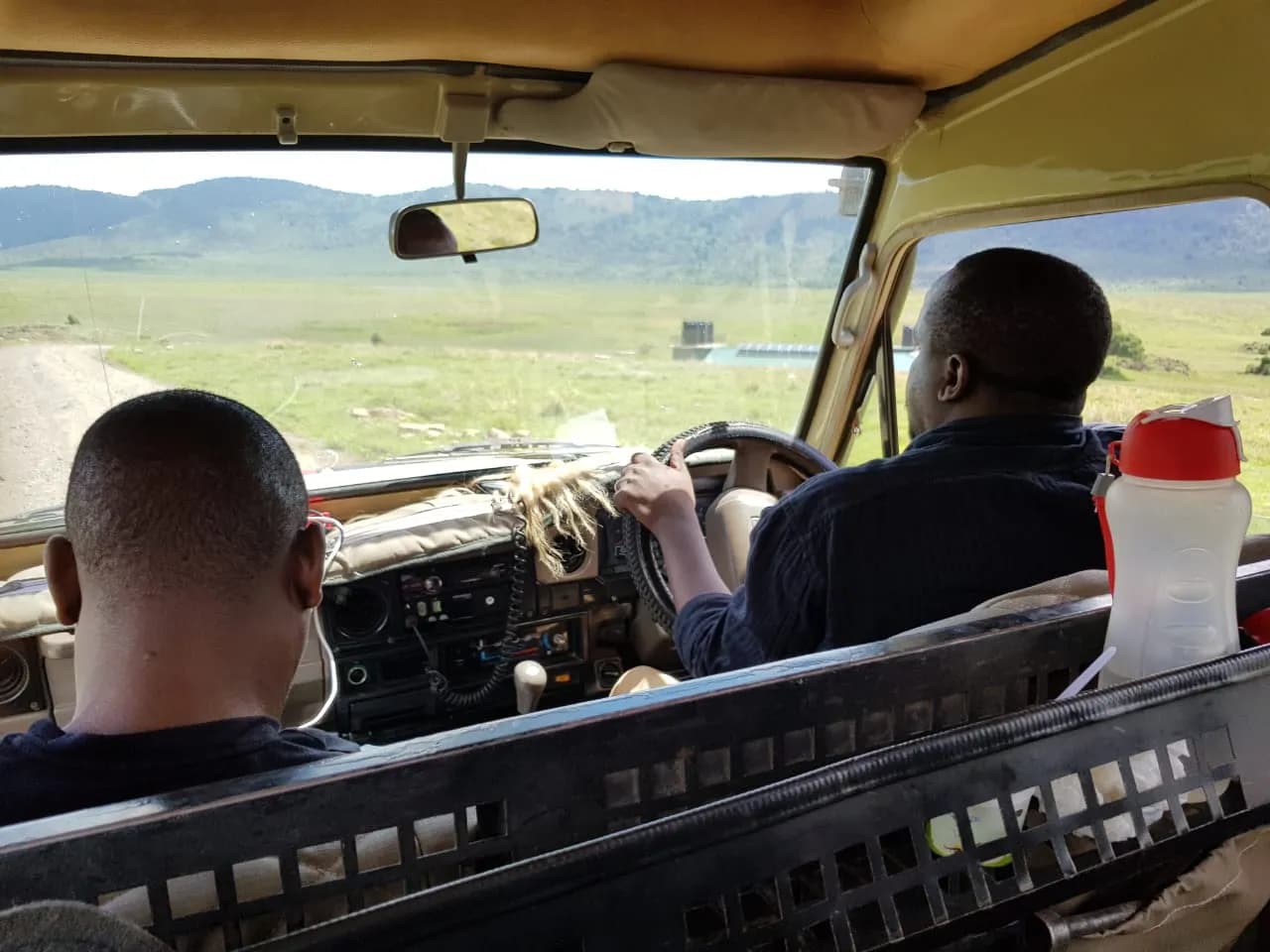 A Maguca driver-guide at the wheel during a morning game drive.